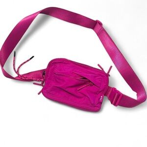 Iris and Rainbow boutique belt bag in vibrant fuschia